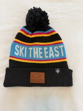 Subaru “Ski The East” Pom Beanie - Black with‎ Multicolor Stripes